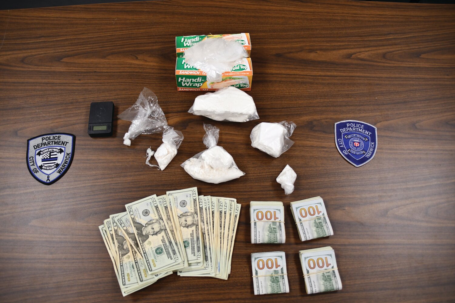 SEIZED: Warwick Police say they seized “17.1 ounces of cocaine, a sum of U.S. currency, and items related to the distribution of cocaine” during a raid at 29 Dan St. (Photo courtesy WPD)
